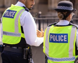 Male and female officer walking the beat