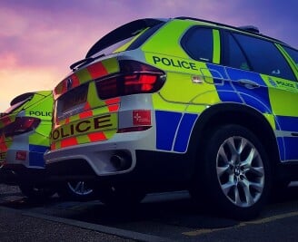 Police cars parked outside police station v2