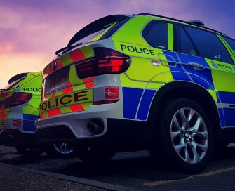 Police cars parked outside police station v2