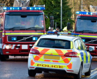 Close up of police car and two fire engines