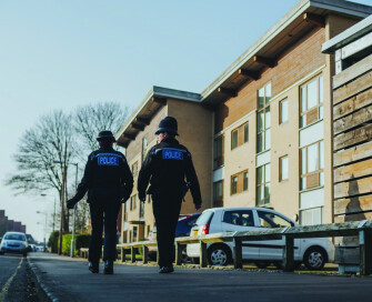 Male and female officer walking the beat in Norfolk CMYK