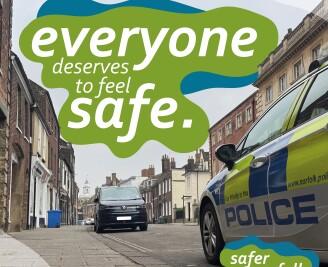 Safer Norfolk logo and cars in background