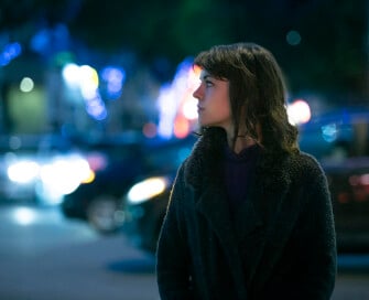 Woman in a street at night