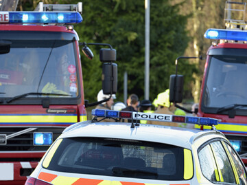 Fire engines and police car on street