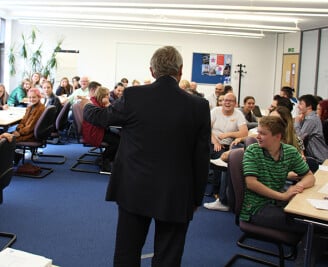 Back view of former PCC Lorne Green talking to room full of young people